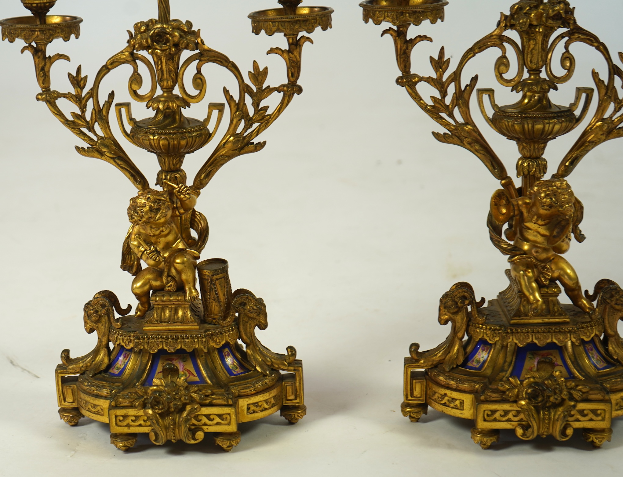 A pair of 19th century French Louis XVI style ormolu three light candelabra